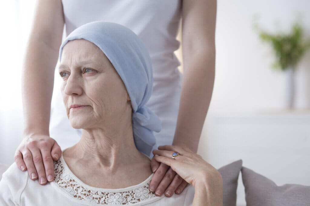 Woman with cancer sitting down