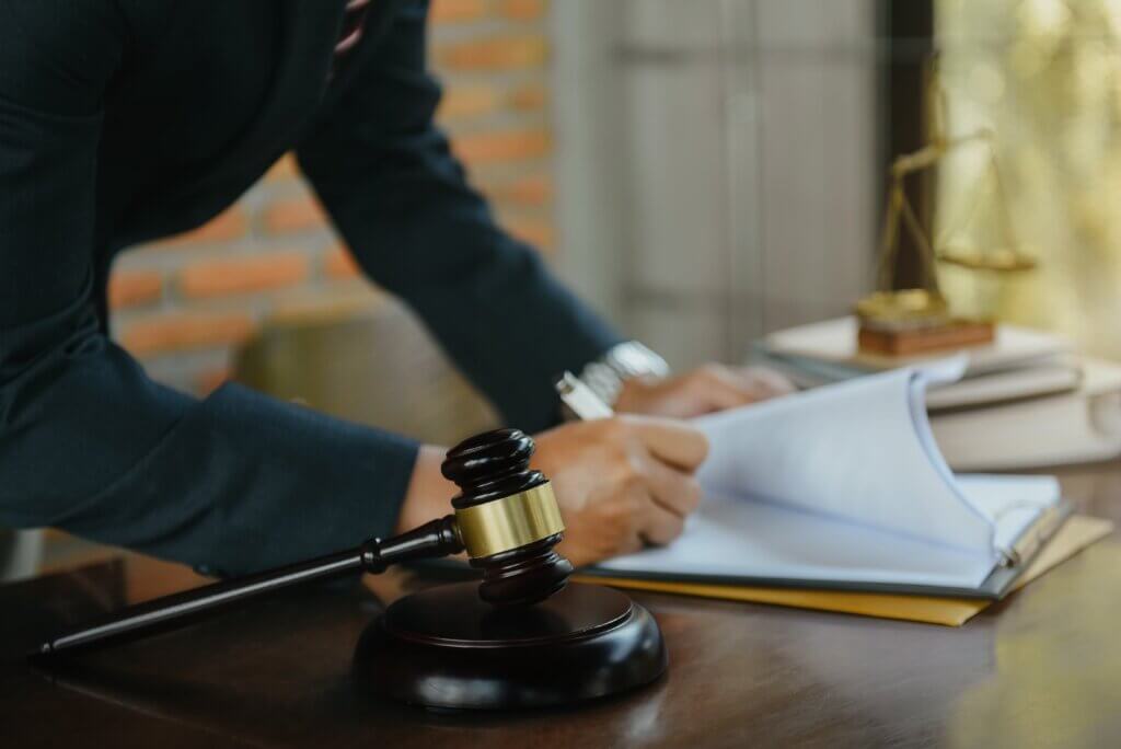 A lawyer signing documents