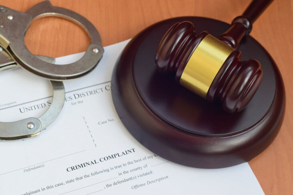 gavel and handcuffs on a  table
